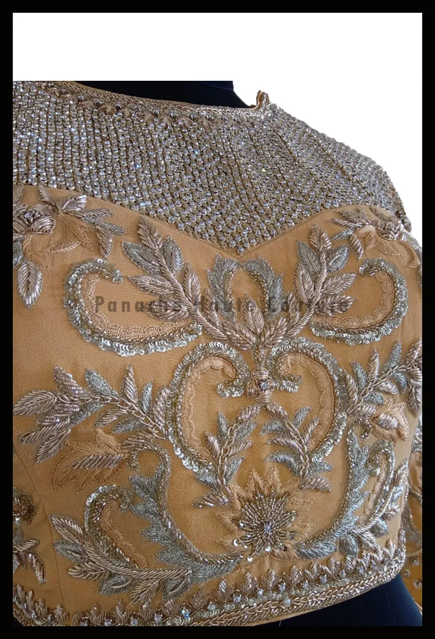 An Elegant Gold Beige Party Wear Lehenga Paired with a Silk Georgette Dupatta