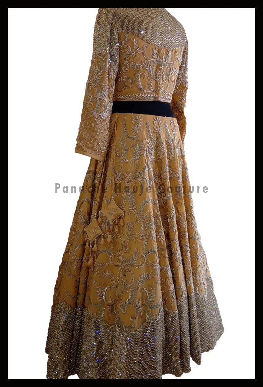 An Elegant Gold Beige Party Wear Lehenga Paired with a Silk Georgette Dupatta
