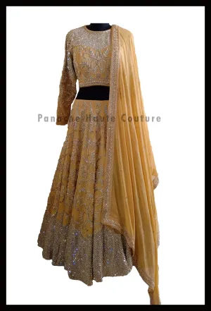 An Elegant Gold Beige Party Wear Lehenga Paired with a Silk Georgette Dupatta