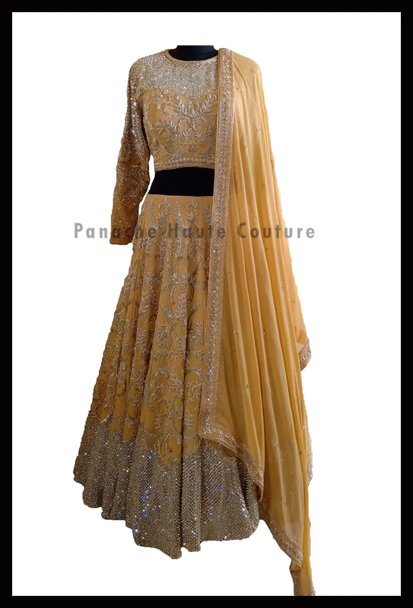 An Elegant Gold Beige Party Wear Lehenga Paired with a Silk Georgette Dupatta