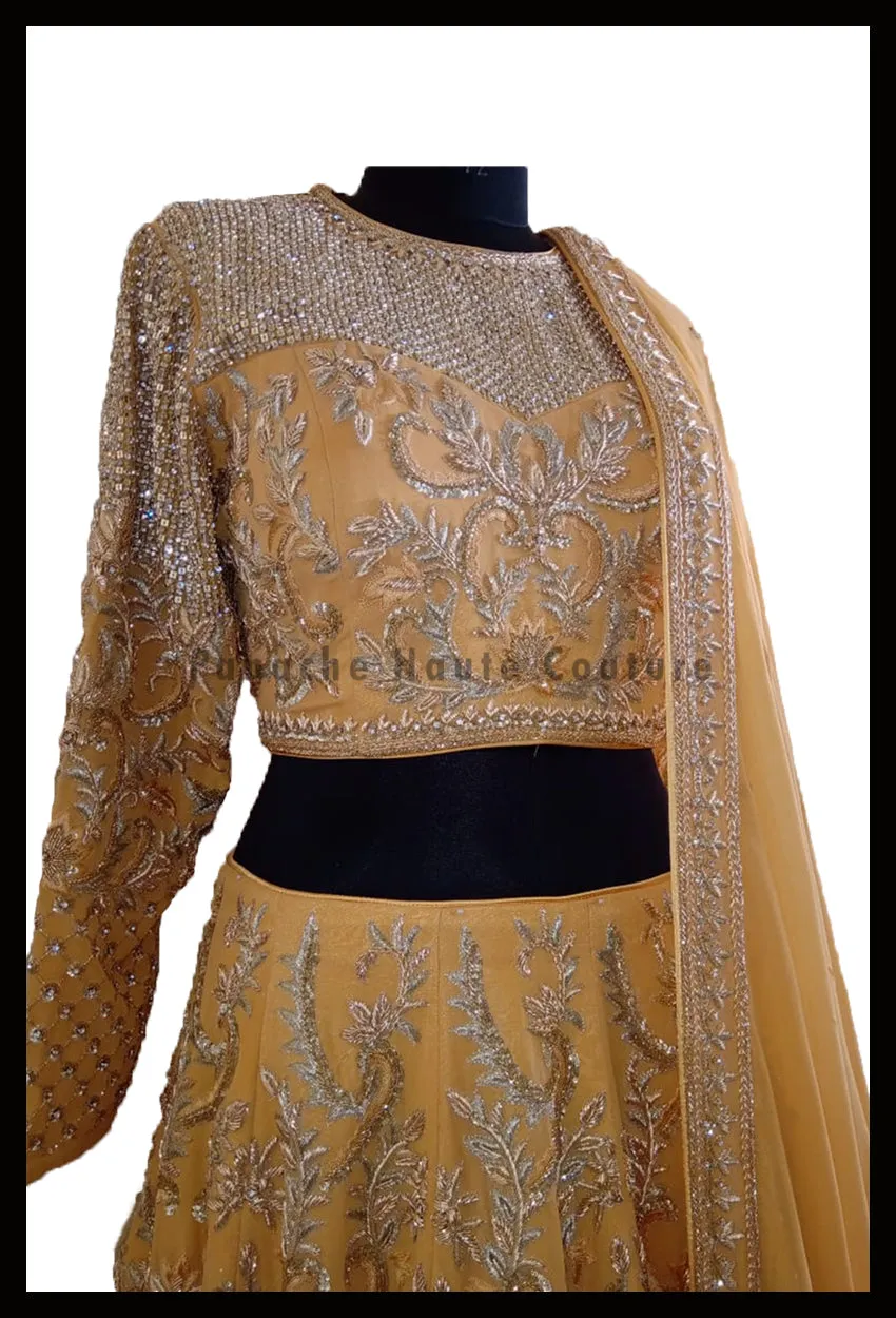 An Elegant Gold Beige Party Wear Lehenga Paired with a Silk Georgette Dupatta