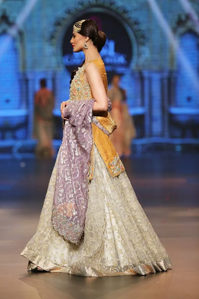 Designer embroidered lehnga dress in lilac, gold and white color # B3355