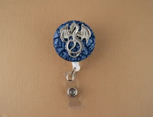 Silver dragon on blue scales badge reel